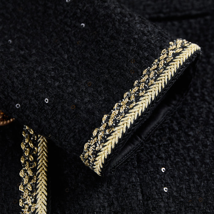 Long sleeve cuff finished with cream-gold braided trim