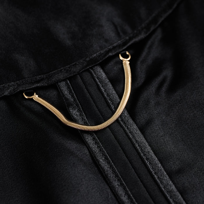 Interior neckline of the jacket with a gold-tone hanging chain