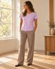 Purple Pima cotton tee styled with taupe trousers
